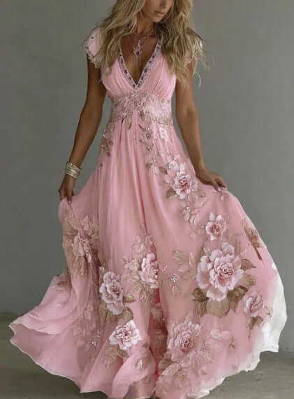 Women's pastel printed dress with pink floral design, elegant and flowing for stylish occasions.