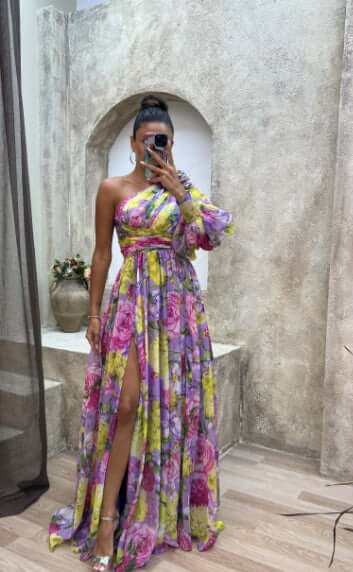 Floral print split maxi dress featuring one shoulder design and long sleeves, perfect for evening events.